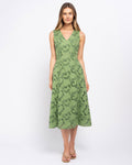 Stella Women's Sara Midi Dress - Green. A woman modeling a sleeveless V-neck midi dress in sage green with a black abstract pattern, standing against a plain white studio background.
