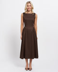 Stella Women's Tammy Midi Dress - Chocolate. A woman modeling a sleeveless midi dress in a solid dark brown color, standing against a plain light gray studio background.